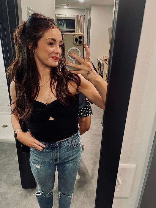 A reviewer wearing the top in black.