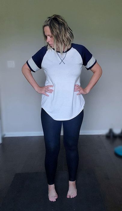 A reviewer is seen wearing a black and white top.