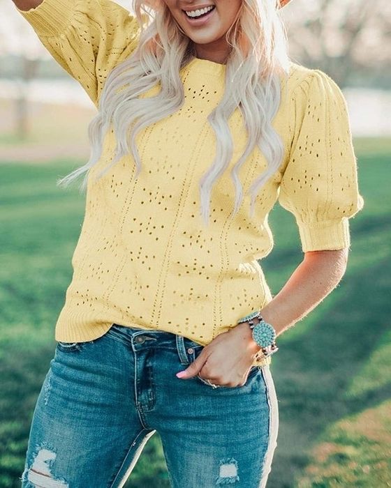 Front view of a model rocking the top in yellow