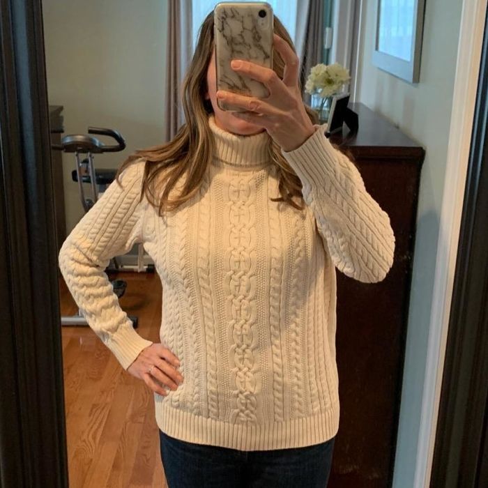 Reviewer showing off the white sweater