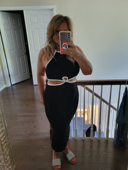 A reviewer wearing the dress
