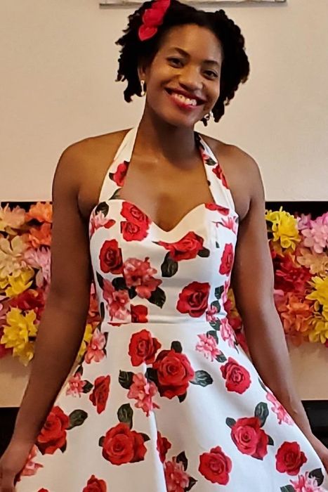 The dress in white featuring a red rose print