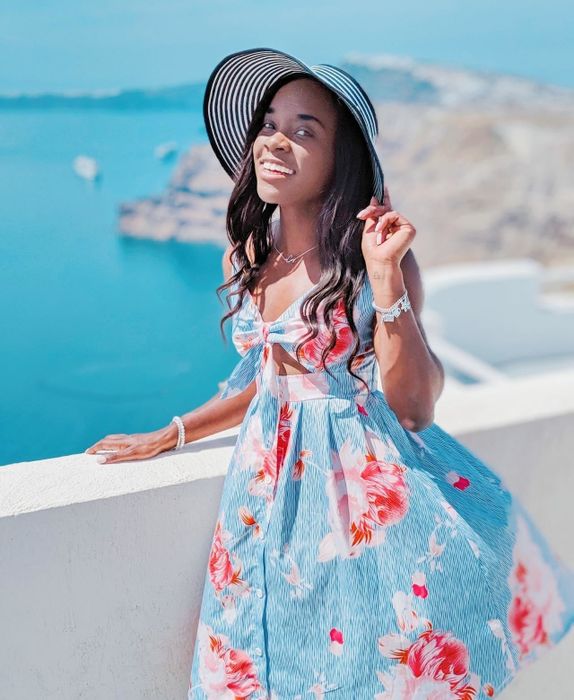 A reviewer rocking the red and blue striped floral dress