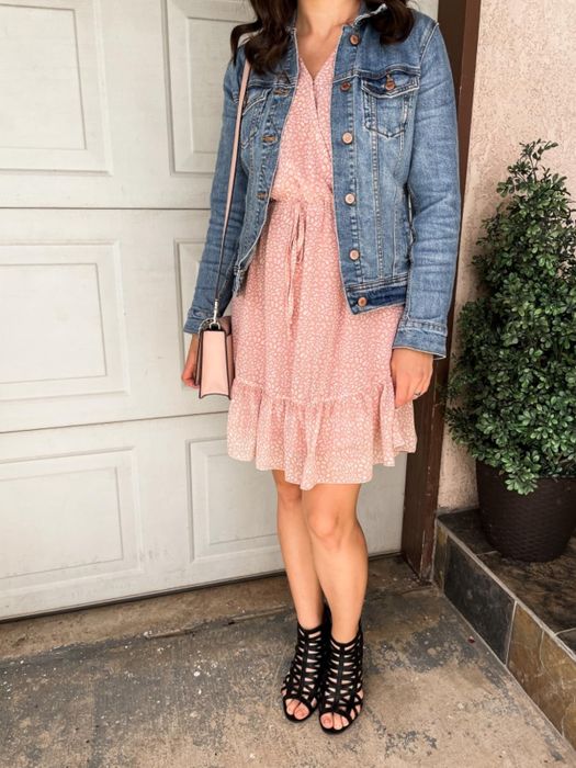 Reviewer in a pink dress, layered with a denim jacket