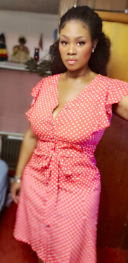 A reviewer wearing the dress