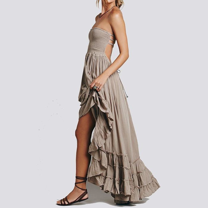 A model showcasing the open-back maxi dress