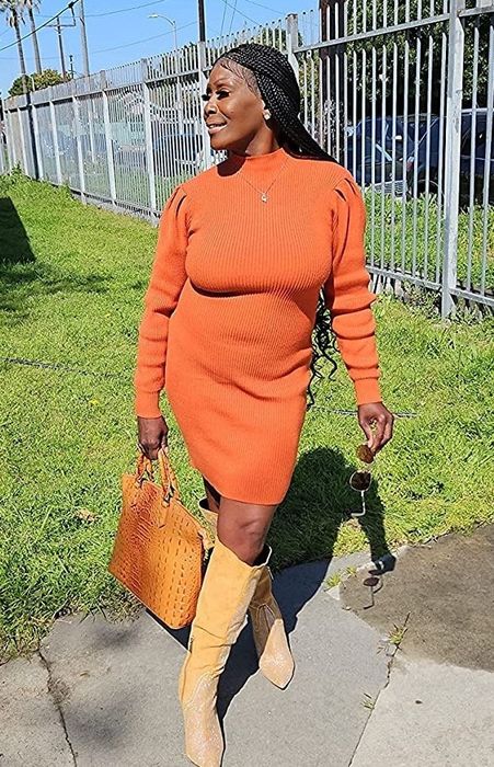 A reviewer in a rust orange dress shares their experience.