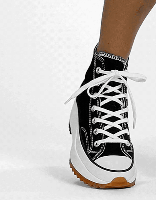 A model showcasing a 360-degree view of a chunky sneaker.