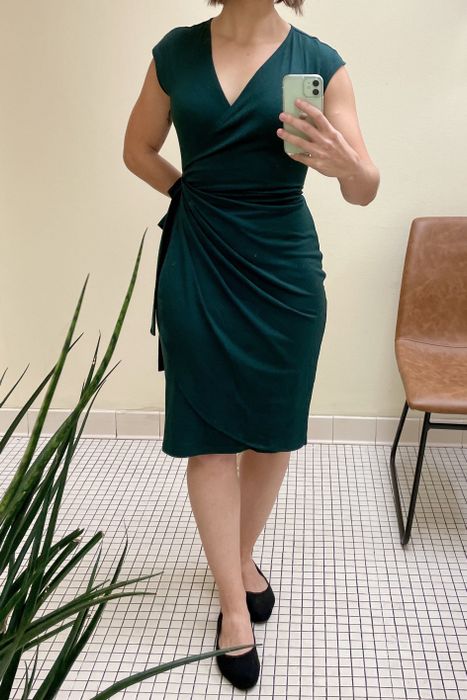 a reviewer styling the dress in dark green