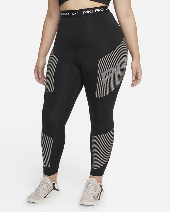 The model is wearing black leggings with white stripes running across them.