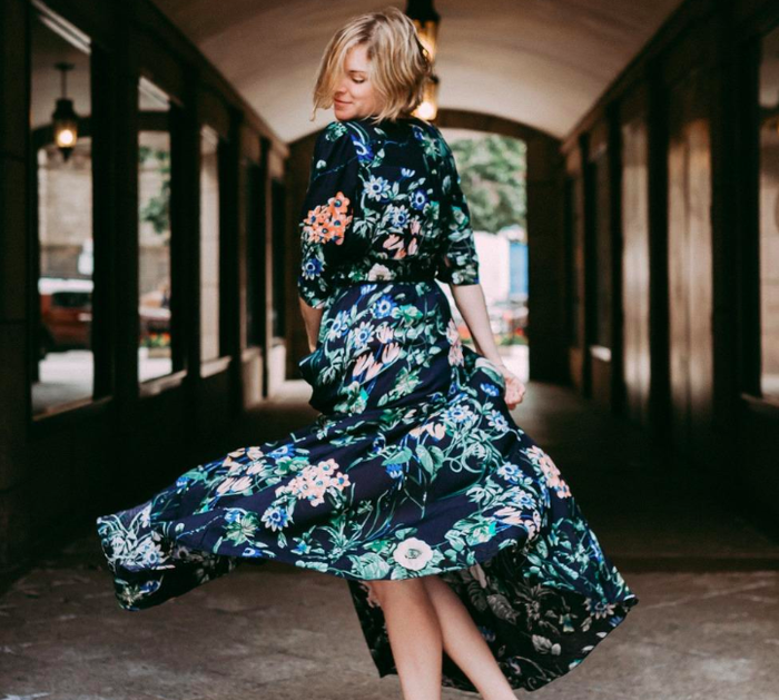 A customer sharing a photo of themselves spinning in the dress, showcasing its flowy design