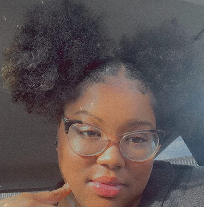 A reviewer wearing the bands while sporting hair in buns.