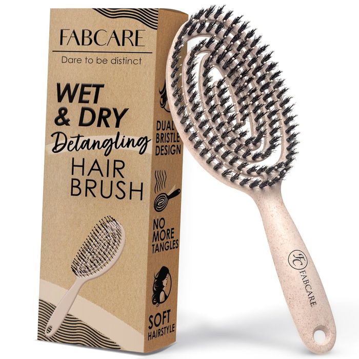 Fabcare Wet & Dry Detangling Hair Brush with dual bristle design, shown with packaging that highlights features like no tangles and a smooth hairstyle