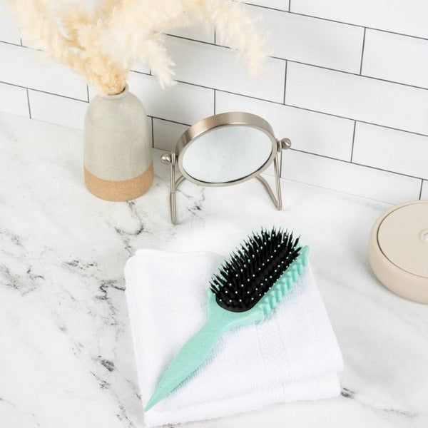 A light blue hairbrush with black bristles