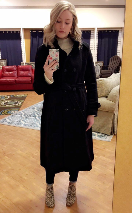 Another reviewer showing off the trench coat in classic black.
