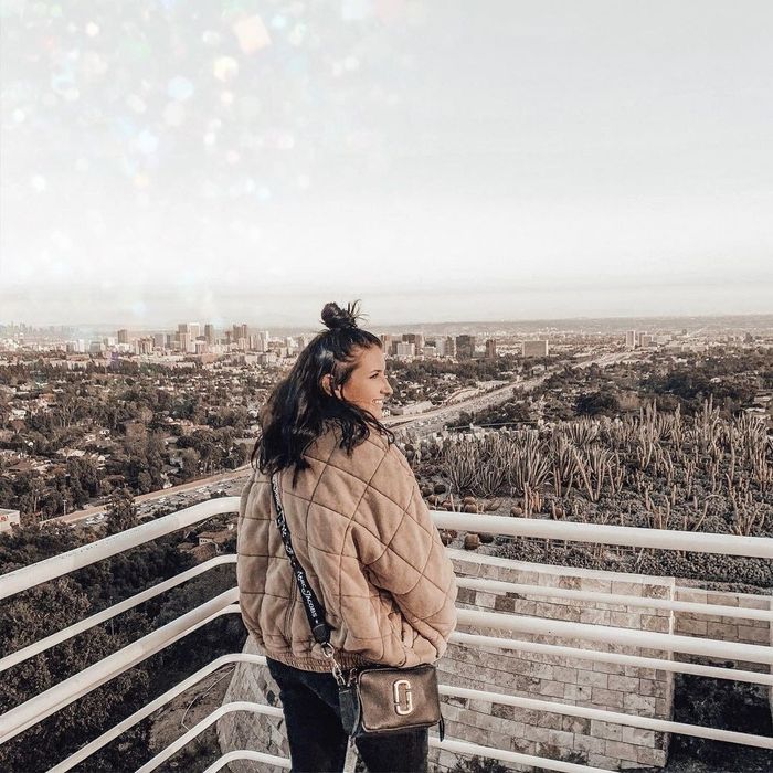 Writer showcasing the Free People quilted coat.