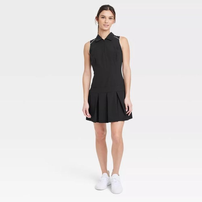 A model sporting the black active dress