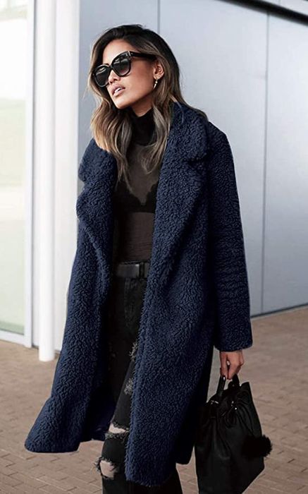 A model showcasing the jacket in navy.
