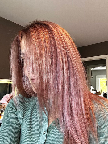 A reviewer with straight, frizz-free, blow-dried hair