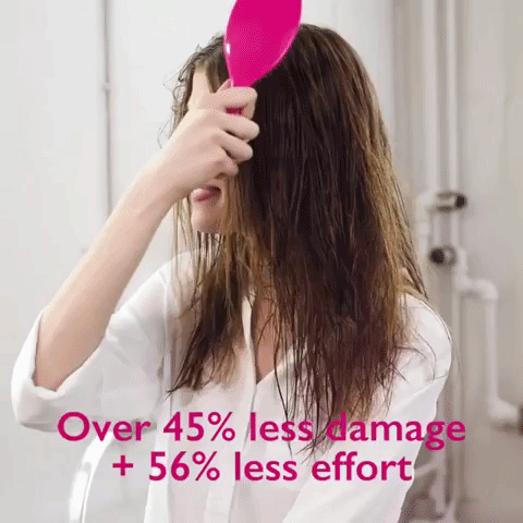 A gif showing the brush smoothly gliding through wet, mostly straight hair, with text overlay reading '45% less damage and 56% less effort'