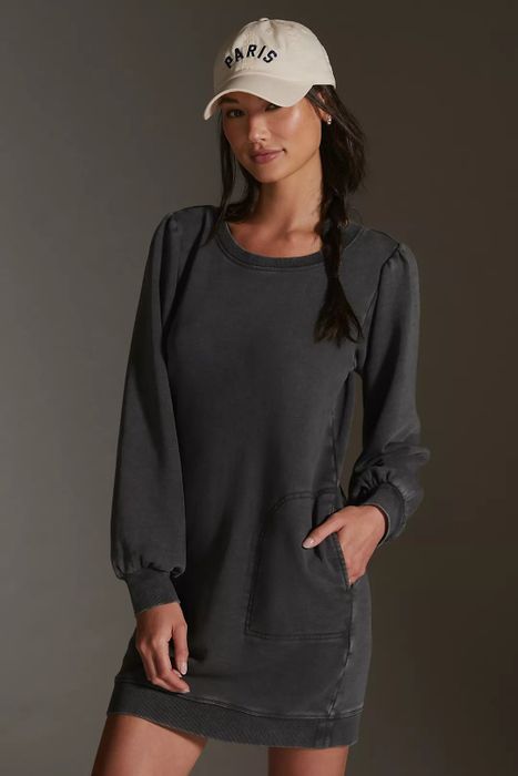 model wearing the gray dress and a baseball cap