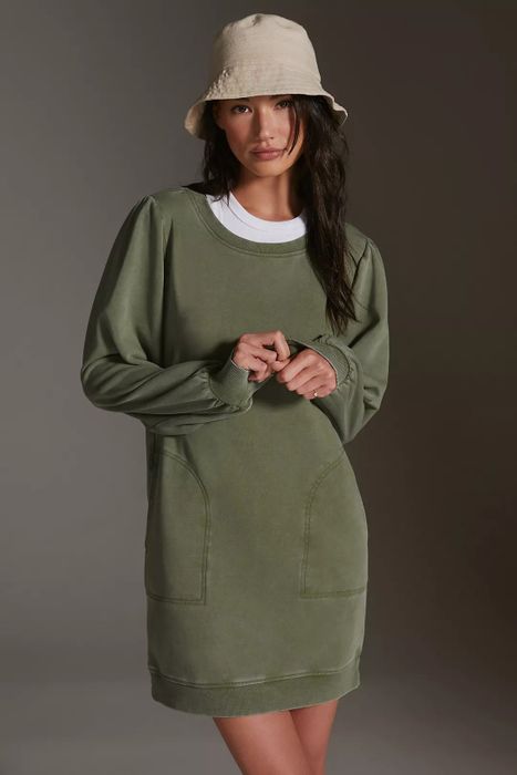 model wearing the green dress and a bucket hat