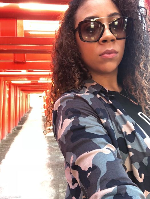 A reviewer showcasing their slightly frizzy curls