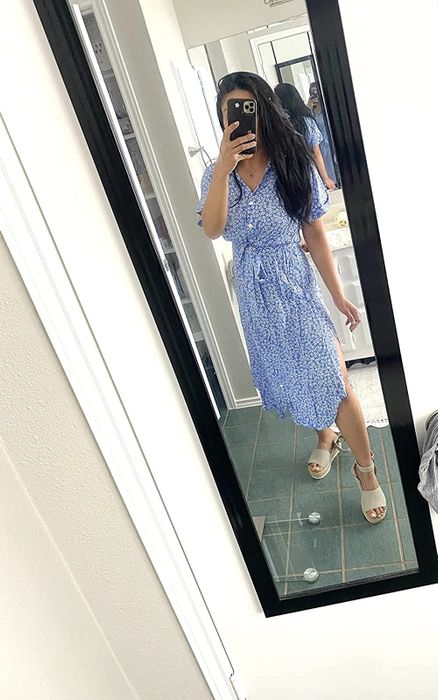 A reviewer wearing the same dress in a white and blue color combination