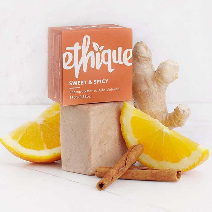 The soap bar surrounded by orange slices and cinnamon sticks