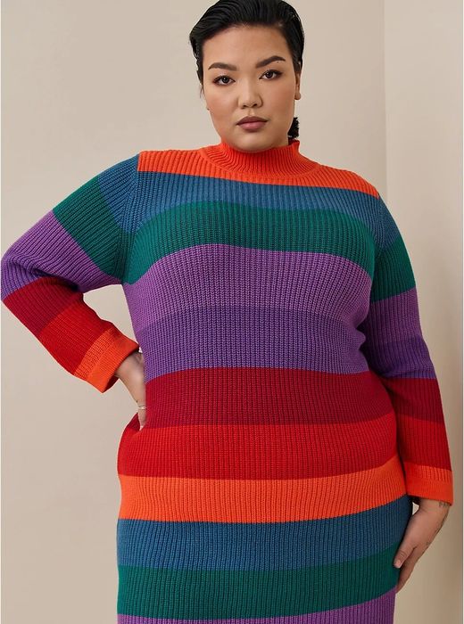 A close-up of the model in the eye-catching multicolored striped dress.