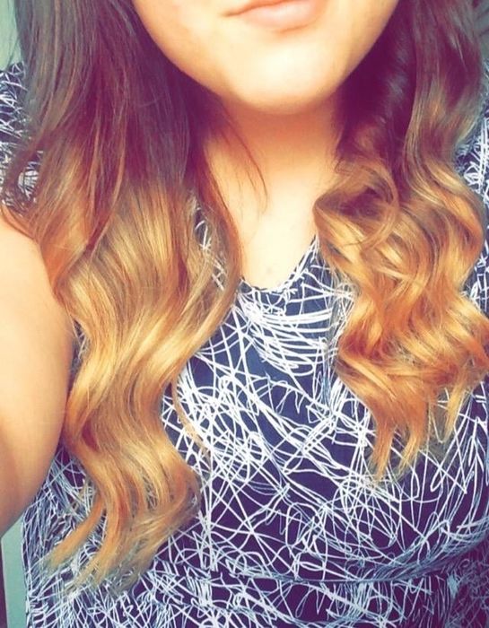 The reviewer's gorgeous curls after using the ceramic curling wand