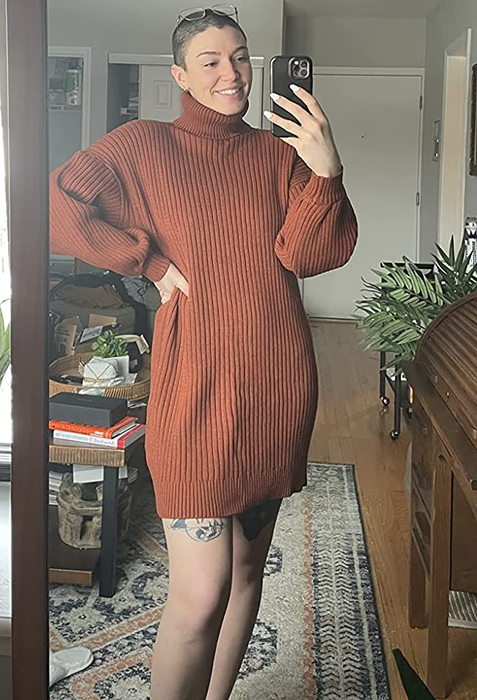 Reviewer showcasing the rust-colored dress.