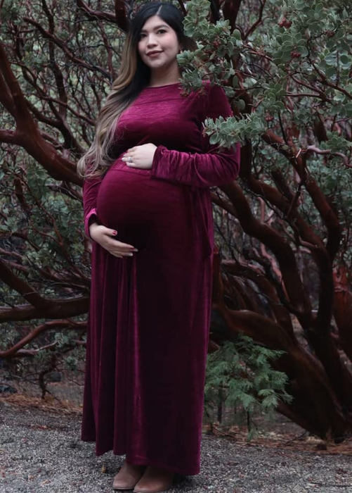 reviewer styling the burgundy velvet dress