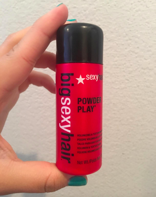 Reviewer holding the powder