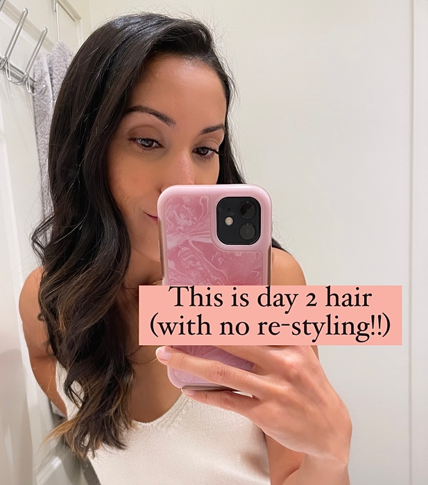 Jasmin showcasing her hair the day after using the TO112 Anti-Humectant Spray with accompanying text