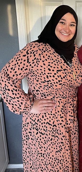 A reviewer wearing the dress
