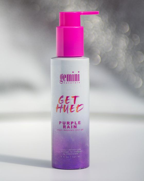 The bottle of vibrant purple hair gel.