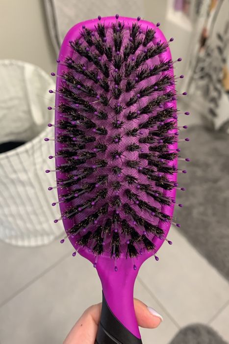 The same hairbrush, now spotless and free of hair buildup