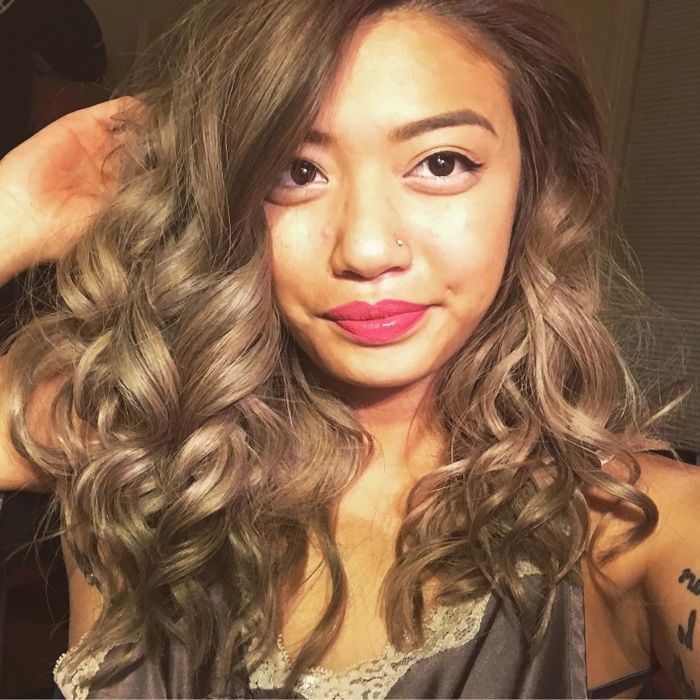 A reviewer showcasing their full and voluminous hair