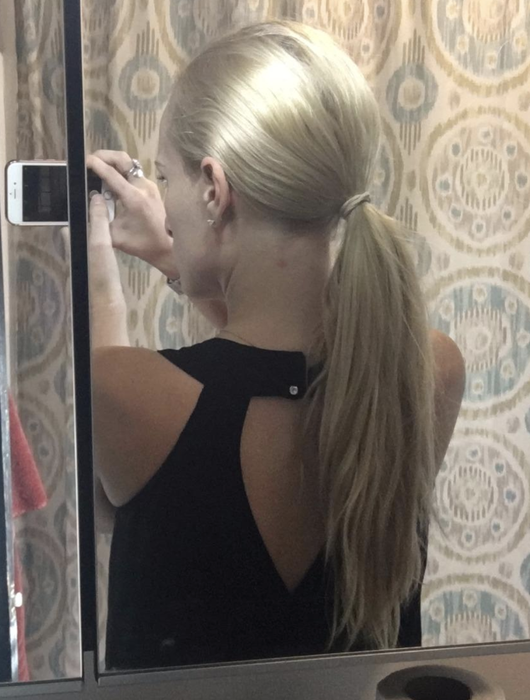 Reviewer with their hair tied up in a ponytail
