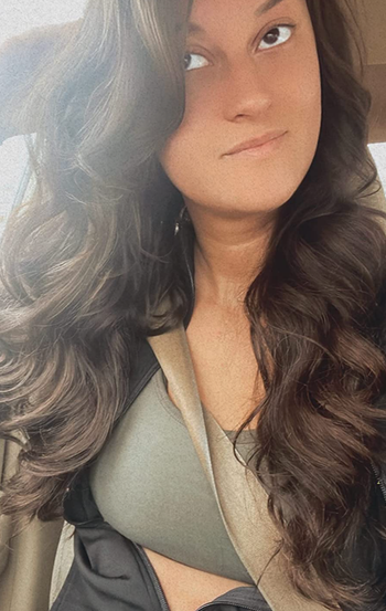 Reviewer showcasing long hair styled in wide curls