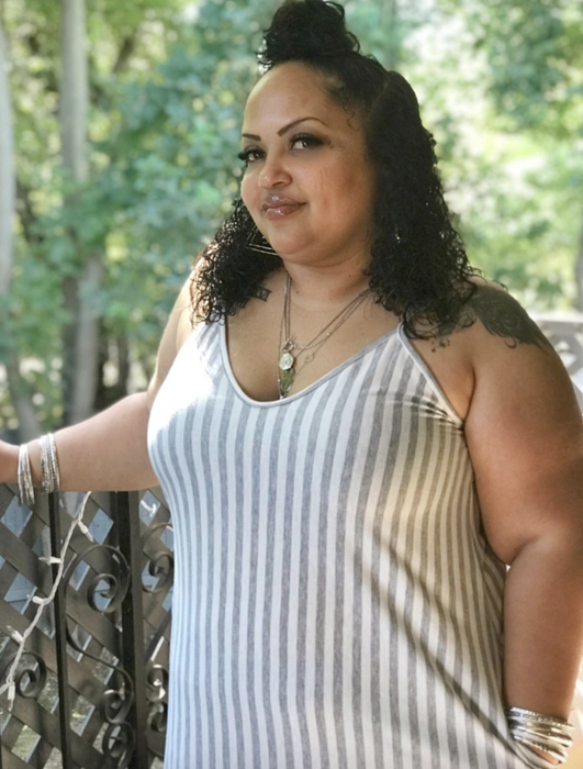 A reviewer in the dress, showing off the fit.