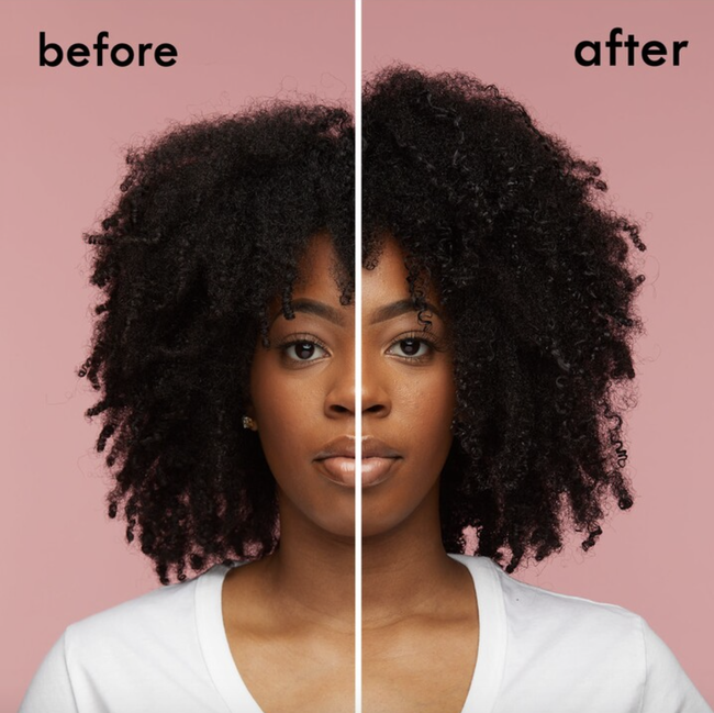 A Black model with natural hair demonstrates bouncier, fuller curls after using the oil.