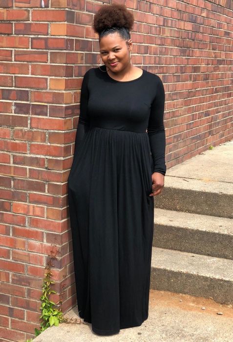 Reviewer wearing the black dress