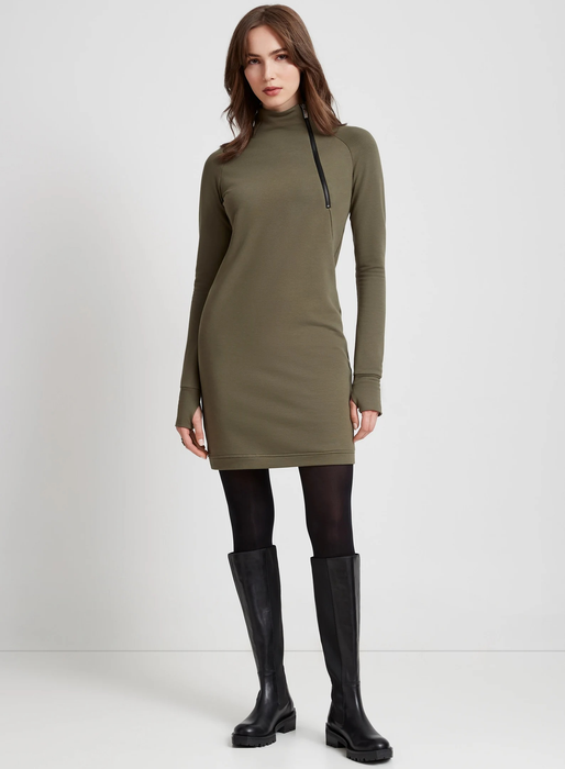 model showcasing the green dress with black tights and boots