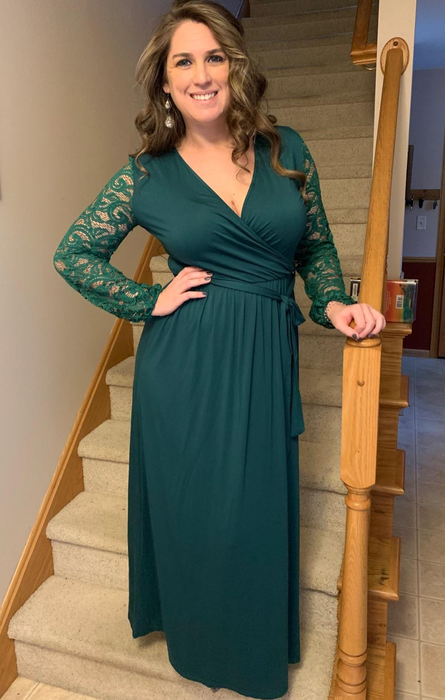 reviewer wearing the green dress