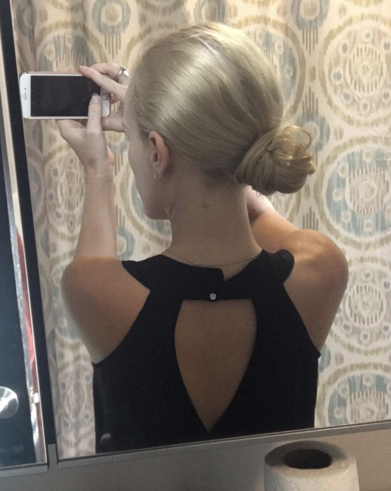 Same reviewer with their hair styled into a neat bun