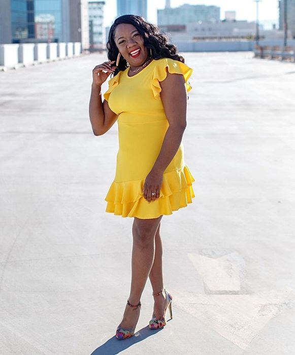 a reviewer wearing the dress in yellow