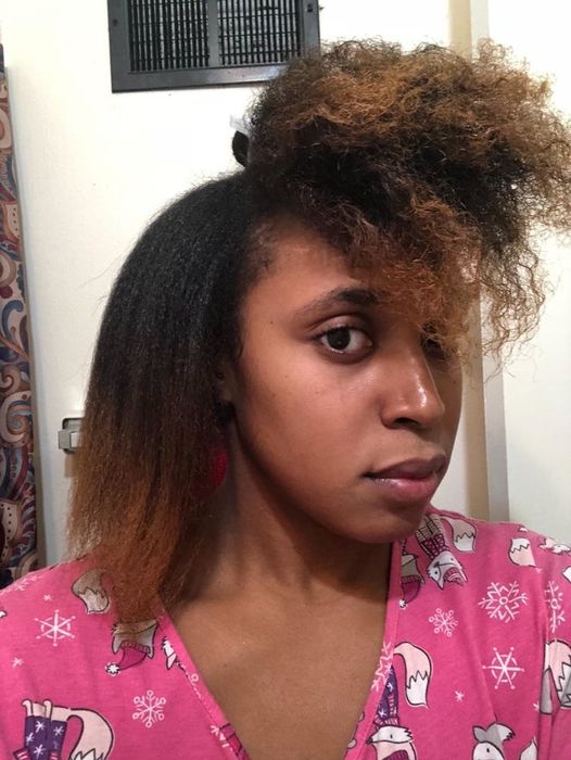 A reviewer showcasing one side of their hair blown out to highlight the difference in volume and smoothness