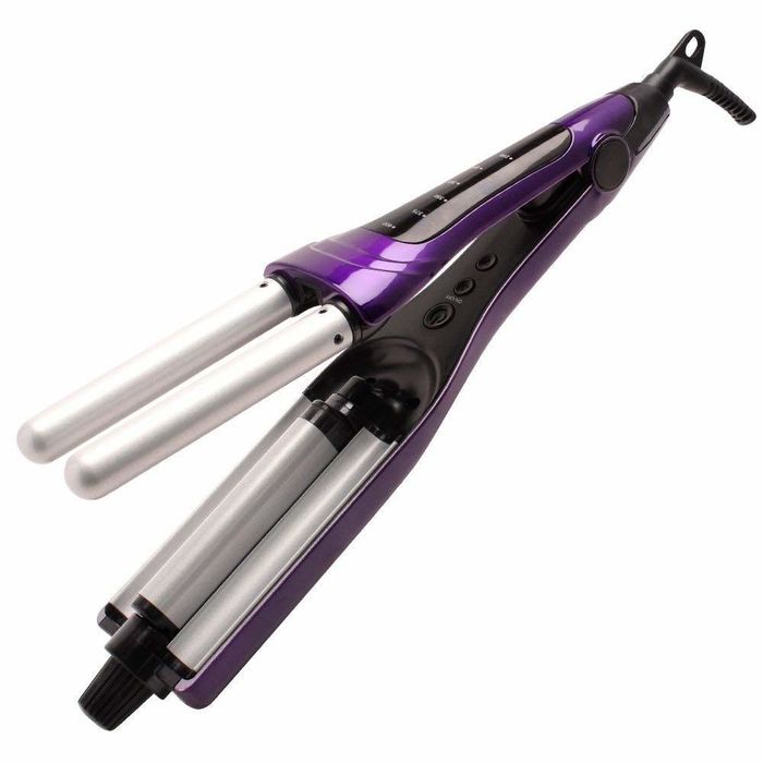 The tool featuring two vertical barrels on one side and one on the other, designed to press waves into your hair